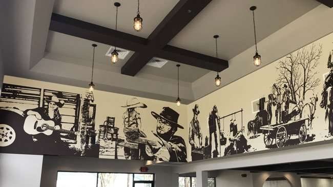 After: Blank upper walls became a western silhouette mural.