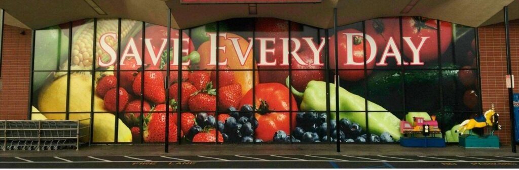 After: Dark storefront glass turned into a full-color fresh-produce display.