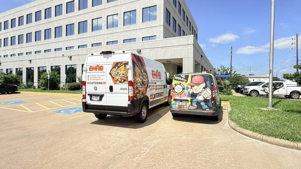 Matching van wraps on a catering fleet in Houston