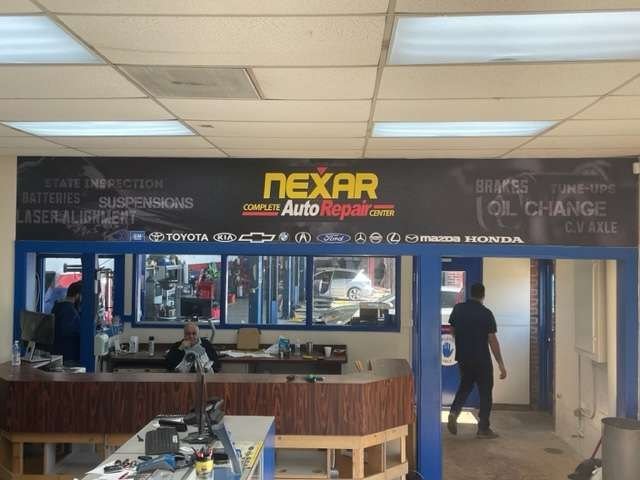Indoor wall sign for Nexar Auto Repair in Houston, TX