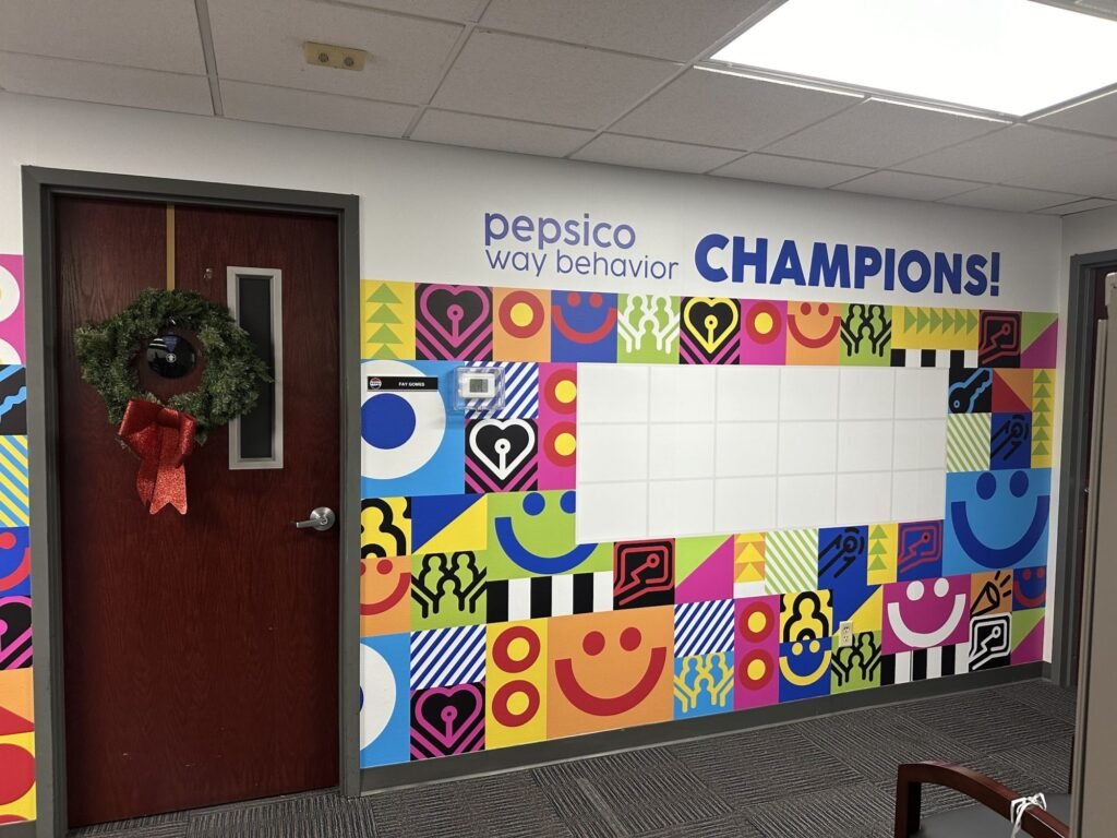 Colorful motivational wall graphics in a PepsiCo office in Houston