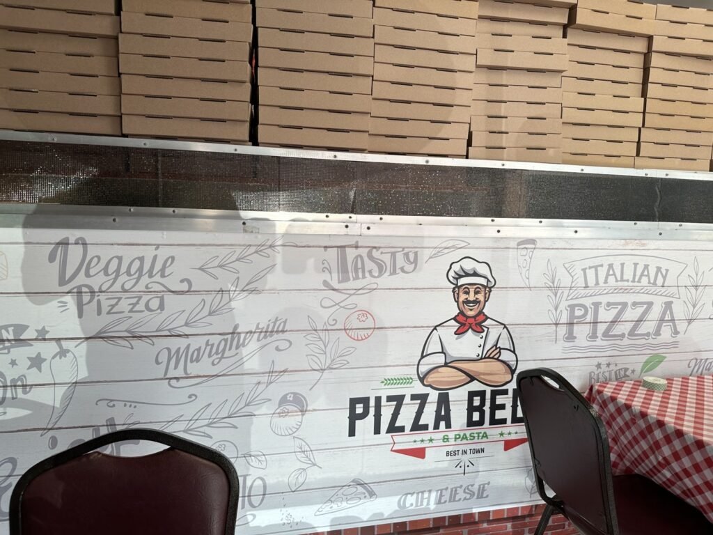 Chalkboard-style wall graphics in a Houston pizza restaurant