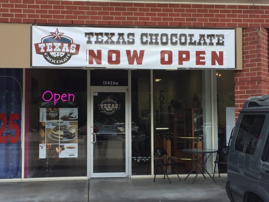 Storefront Sign Banner Texas Chocolate in Houston, TX